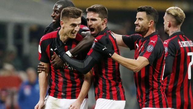 AC Milan's Krzysztof Piatek, second from left, celebrates with his teammates after scoring his side's second goal during an Italian Cup quarter-final soccer match between AC Milan and Napoli at the San Siro stadium, in Milan, Italy(AP)