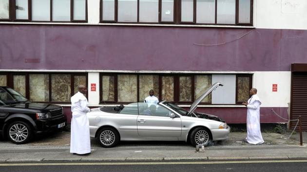 Worshippers bless a vehicle to keep it safe after a member of the congregation had a revelation during Sunday service at the Celestial Church of Christ Grace of God Parish in London. “We pray for this country,” said Abosede Ajibade, a 54-year-old Nigerian who moved to Britain in 2002 and works for an office maintenance company. “People here brought Christianity to Africa but it doesn’t feel like they serve Jesus Christ any more.” (Simon Dawson / REUTERS) Worshippers bless a vehicle to keep it safe after a member of the congregation had a revelation during Sunday service at the Celestial Church of Christ Grace of God Parish in London. “We pray for this country,” said Abosede Ajibade, a 54-year-old Nigerian who moved to Britain in 2002 and works for an office maintenance company. “People here brought Christianity to Africa but it doesn’t feel like they serve Jesus Christ any more.” (Simon Dawson / REUTERS)