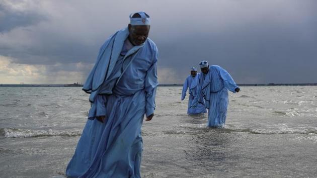 Senior members of the Apostles of Muchinjikwa Christian church leave the sea after leading a mass Baptism (Jorodhani) on the beachfront on Southend-on-Sea, Britain. Around 250 black majority churches are believed to operate in the borough of Southwark, where 16% of the population identifies as having African ethnicity. (Simon Dawson / REUTERS) Senior members of the Apostles of Muchinjikwa Christian church leave the sea after leading a mass Baptism (Jorodhani) on the beachfront on Southend-on-Sea, Britain. Around 250 black majority churches are believed to operate in the borough of Southwark, where 16% of the population identifies as having African ethnicity. (Simon Dawson / REUTERS)