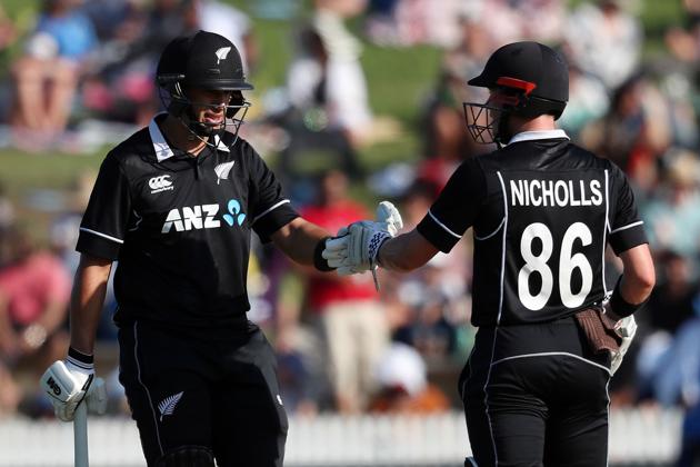 New Zealand's Ross Taylor (L) and Henry Nicholls gesture during the fourth one-day international cricket match between New Zealand and India at Seddon Park in Hamilton. (AFP) 