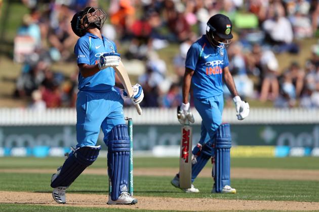 India's Kuldeep Yadav (L) is dismissed during the fourth one-day international cricket match between New Zealand and India at Seddon Park in Hamilton. (AFP) 