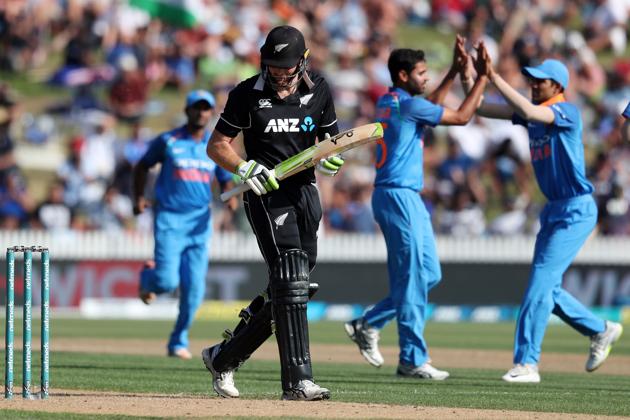 New Zealand's Martin Guptill (C) reacts after being dimissed during the fourth one-day international cricket match between New Zealand and India at Seddon Park in Hamilton. (AFP) 