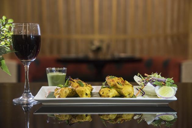 With a creamy preparation like a Badami Chicken or an Afghani Chicken, white with almonds or cashews, an inexpensive red hits the spot. Above, Afghani kebabs are paired with a red Cabernet Sauvignon at Zaffran, Lower Parel.(Aalok Soni / HT Photo)