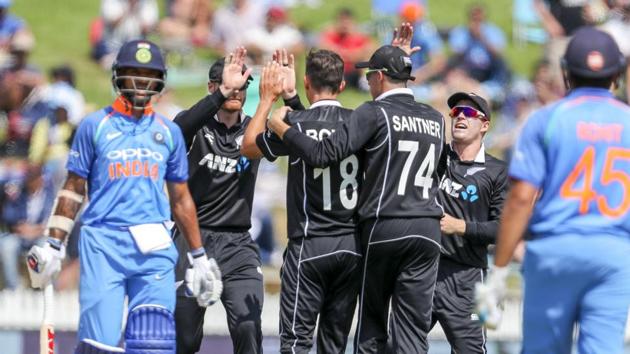 New Zealand players celebrate the wicket of India opener Shikhar Dhawan at Seddon Park in Hamilton.(AP)