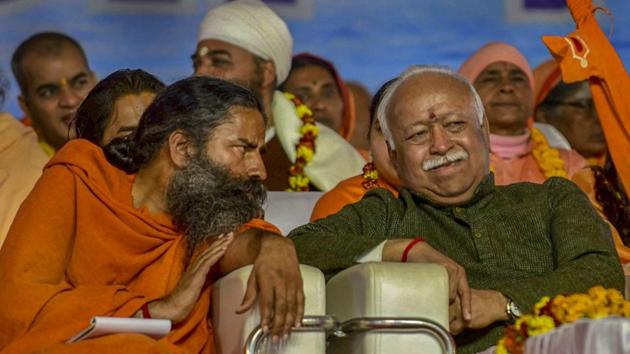RSS chief Mohan Bhagwat and Baba Ramdev (left) attend Vishwa Hindu Parishad's 'Dharm Sansad' at the Kumbh Mela 2019 in Prayagraj on Thursday. (PTI) RSS chief Mohan Bhagwat and Baba Ramdev (left) attend Vishwa Hindu Parishad's 'Dharm Sansad' at the Kumbh Mela 2019 in Prayagraj on Thursday. (PTI)