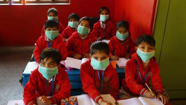 Students, wearing masks as protection against Swine Flu, attend a class at a school . Over 500 cases of swine flu have been reported from Delhi in January.(PTI / Representative Photo)