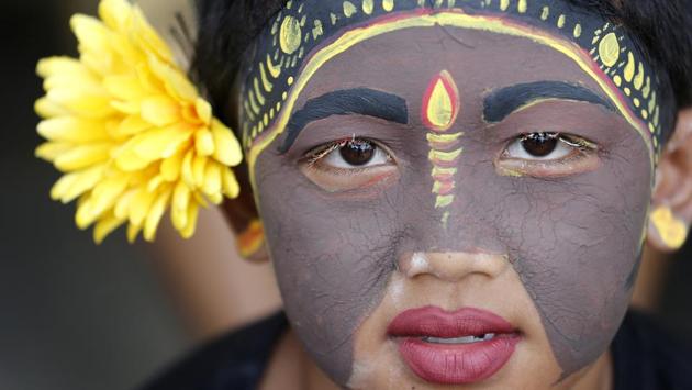 A Balinese youth participates in the Hindu ritual of “Grebeg” at the Tegalalang village in Bali, Indonesia. In this biannual ritual, young participants paint their bodies with colorful paint and parade around their village to ward off evil spirits. (Firdia Lisnawati / AP)