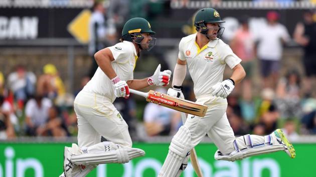 Australia batsmen Travis Head (left) and Joe Burns during their 308-run partnership on the first day of the second Test against Sri Lanka.(AFP)