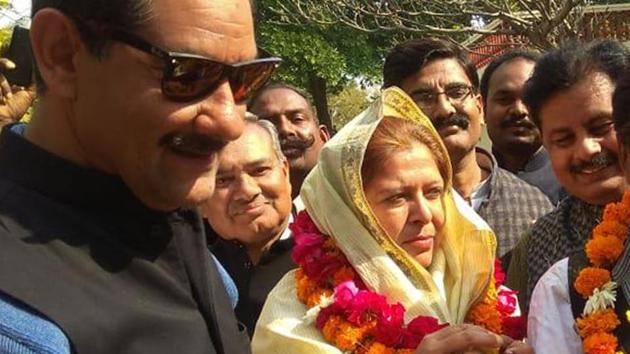 (FROM LEFT) Jitendra Singh, Congress candidate Shafia Khan and her husband Zubair Khan celebrate Shafia’s victory in Ramgarh polls, on Thursday, January 31, 2019.(HT Photo)
