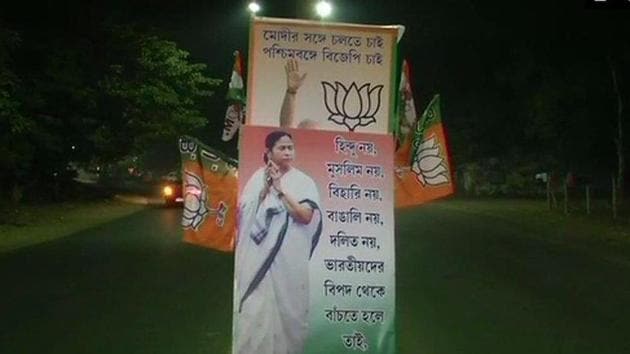 With elections in the air, the Trinamool-Bharatiya Janata Party political rivalry translated into a poster war ahead of Prime Minister Narendra first public meeting for the 2019 Lok Sabha campaign in Bengal./(ANI Photo/Twitter) With elections in the air, the Trinamool-Bharatiya Janata Party political rivalry translated into a poster war ahead of Prime Minister Narendra first public meeting for the 2019 Lok Sabha campaign in Bengal./(ANI Photo/Twitter)