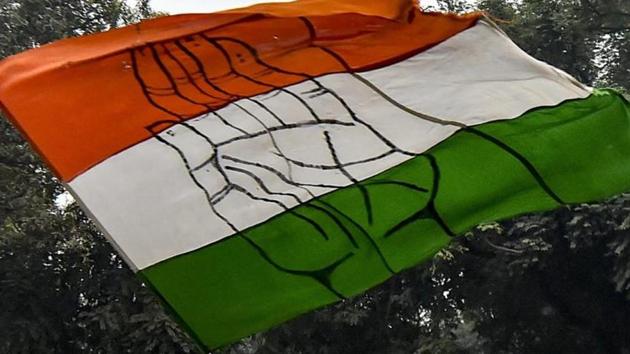 Congress party flag being waved by supporters at the party headquarters in New Delhi on December 11, 2018. (PTI Photo) Congress party flag being waved by supporters at the party headquarters in New Delhi on December 11, 2018. (PTI Photo)
