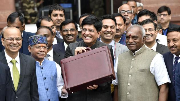 Finance Minister Piyush Goyal (C) along with his full Budget team leaves for Rashtrapati Bhawan, at North Block, in New Delhi. (Ajay Aggarwal / HT Photo)