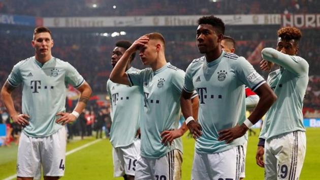Bayern Munich's Joshua Kimmich looks dejected after the match with David Alaba and team mates.(REUTERS) Bayern Munich's Joshua Kimmich looks dejected after the match with David Alaba and team mates.(REUTERS)