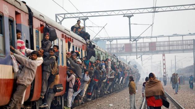 Commuters travel in an overcrowded train near a railway station in Ghaziabad, on the outskirts of New Delhi, India, February 1, 2019.(REUTERS)