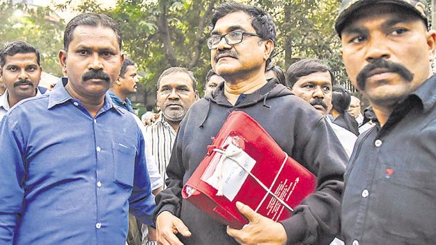 Anand Teltumbde (centre) leaving a court in Pune after he was released on Saturday. (Sanket Wankhade/HT PHOTO) Anand Teltumbde (centre) leaving a court in Pune after he was released on Saturday. (Sanket Wankhade/HT PHOTO)