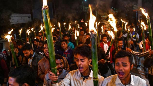 Activists of All Assam Students Union (AASU) along with 30 indigenous organizations take out a torch light procession to protest against the Citizenship Amendment bill in Guwahati.(AFP)