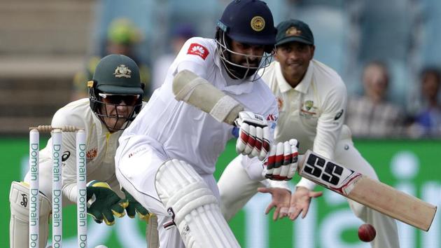 Sri Lanka's Lahiru Thirimanne, center, plays a sweep in front of Australia's Tim Paine. (AP) Sri Lanka's Lahiru Thirimanne, center, plays a sweep in front of Australia's Tim Paine. (AP)