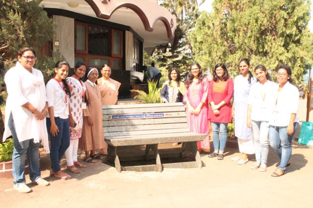 Students and teachers of St Teresa’s Institute of Education, Santacruz stand besides the bench made from used Tetra Pak cartons.(HT PHOTO)