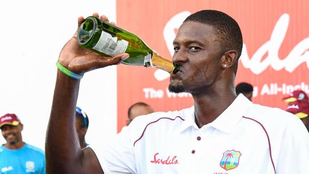 Jason Holder celebrates after the Windies won the second Test against England at the Vivian Richards Cricket Stadium in North Sound. (AFP) Jason Holder celebrates after the Windies won the second Test against England at the Vivian Richards Cricket Stadium in North Sound. (AFP)