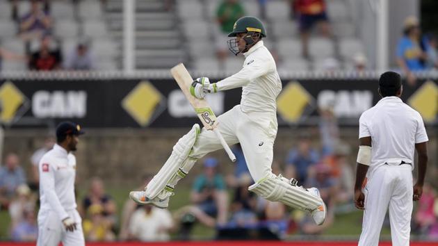 Australia's Usman Khawaja jumps up as he celebrates making 100 runs against Sri Lanka on day 3 of their cricket test match in Canberra, Sunday, Feb. 3, 2019 (AP) Australia's Usman Khawaja jumps up as he celebrates making 100 runs against Sri Lanka on day 3 of their cricket test match in Canberra, Sunday, Feb. 3, 2019 (AP)