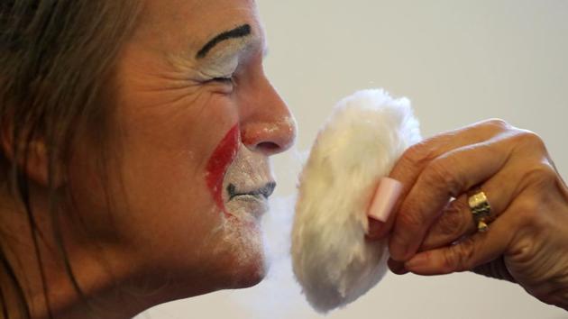 A clowns puts on make-up before the annual Grimaldi Memorial Service. “We have people flying in from Canada, Ireland, from France, people coming down from Scotland” for the “funny reverential service remembering the legend,” organiser Bibbledy Bob said. (Daniel Leal-Olivas / AFP) A clowns puts on make-up before the annual Grimaldi Memorial Service. “We have people flying in from Canada, Ireland, from France, people coming down from Scotland” for the “funny reverential service remembering the legend,” organiser Bibbledy Bob said. (Daniel Leal-Olivas / AFP)