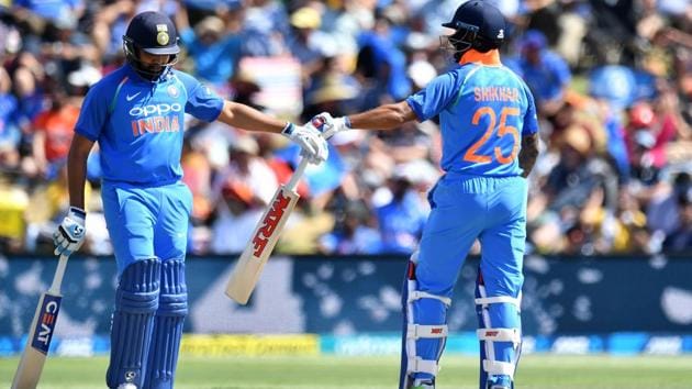 India's Shikhar Dhawan (R) celebrates hitting a four with teammate Rohit Sharma (L) during the second one-day international (ODI) cricket match between New Zealand and India in Tauranga on January 26, 2019(AFP)