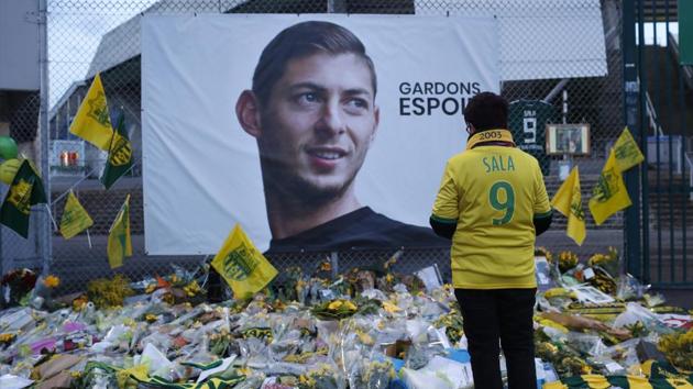 FILE - In this Wednesday, Jan. 30, 2019, file photo, a Nantes soccer team supporters stops by a poster of Argentinian player Emiliano Sala and reading "Let's keep hope" outside La Beaujoire stadium(AP)