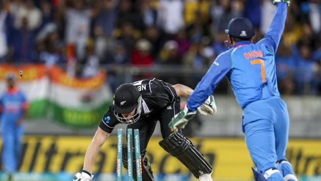 India's MS Dhoni, right, runs out New Zealand's James Neesham during their fifth one day international at Westpac Stadium in Wellington, New Zealand, Sunday, Feb. 3, 2019(AP)