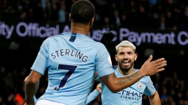Manchester City's Sergio Aguero celebrates scoring their third goal to complete his hat-trick with Raheem Sterling(REUTERS) Manchester City's Sergio Aguero celebrates scoring their third goal to complete his hat-trick with Raheem Sterling(REUTERS)