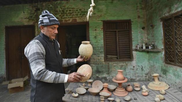 52-year-old school teacher Ramesh Chandra became interested in collecting the remains after finding a pot in his fields. Over the years, his collection has grown to include urns, broken pots, seals and bits and pieces of terracotta jewellery. “I have shown it to visiting historians and archaeologists and they have confirmed it is from ancient times,” he says. (Burhaan Kinu / HT Photo) 52-year-old school teacher Ramesh Chandra became interested in collecting the remains after finding a pot in his fields. Over the years, his collection has grown to include urns, broken pots, seals and bits and pieces of terracotta jewellery. “I have shown it to visiting historians and archaeologists and they have confirmed it is from ancient times,” he says. (Burhaan Kinu / HT Photo)