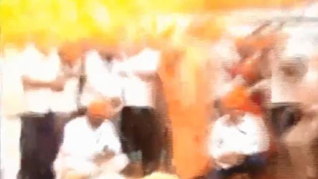 Around two dozen people were standing in a semi circle ahead of the inauguration when the balloons exploded and three people suffered minor injuries in a flash of flame.(Video grab) Around two dozen people were standing in a semi circle ahead of the inauguration when the balloons exploded and three people suffered minor injuries in a flash of flame.(Video grab)