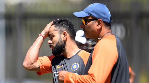 India's cricket captain Virat Kohli (left) with coach Ravi Shastri.(AFP)