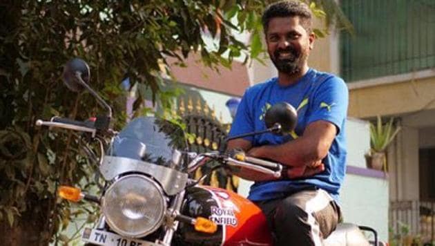 Director Prem Kumar poses with his new bike.