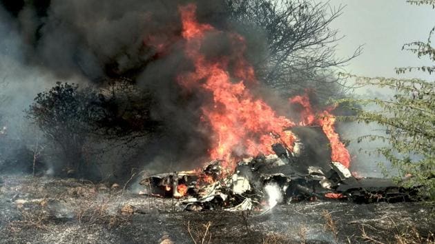 Smoke and fire billow after an Indian Air Force's Mirage 2000 trainer aircraft crashed in the southern city of Bengaluru on February 1.(ANI Photo)