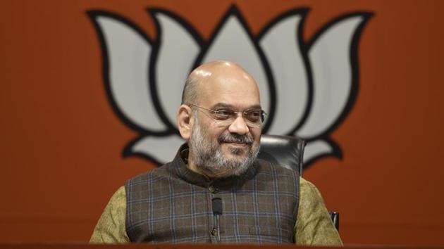 Bharatiya Janata Party president Amit Shah on Wednesday targeted opposition parties over contentious issues including Ayodhya dispute and the National Register of Citizens (NRC) at a rally of party’s booth-level workers in Uttar Pradesh’s Aligarh. He said the BJP is “committed for construction of a Ram temple at the same site in Ayodhya.” (Sanchit Khanna / HT File)
