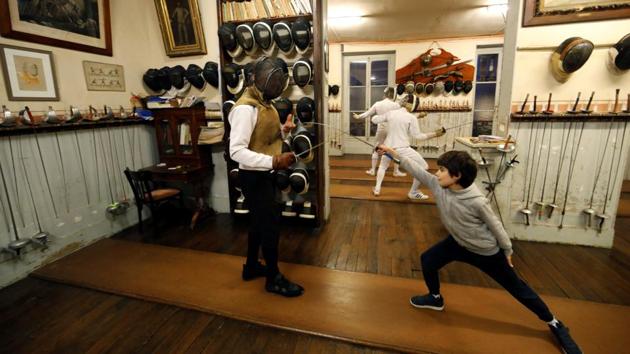 Master Jean-Pierre Pinel La Taule conducts a training session. Fencing enthusiasts meet every night with Wednesdays dedicated to children. (Charles Platiau / REUTERS)
