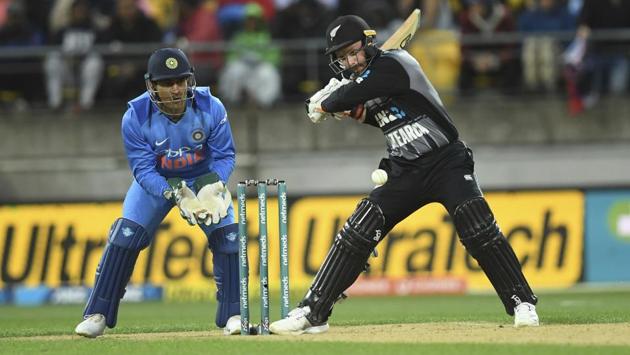 New Zealand's Colin Munro, right, batting in front of India's MS Dhoni. (AP)
