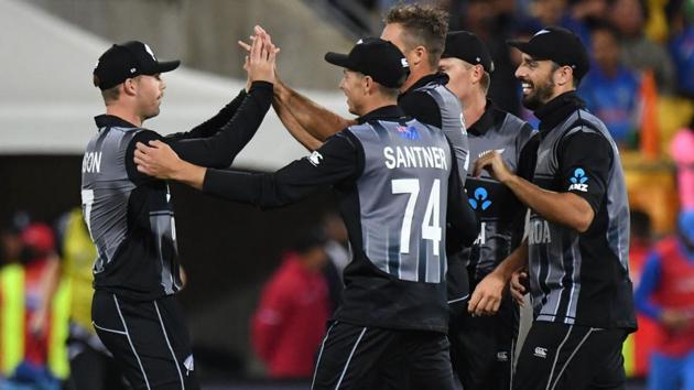 New Zealand's Lockie Ferguson (L) celebrates with teammates after taking a catch off catching India's Rohit Sharma. (AFP)