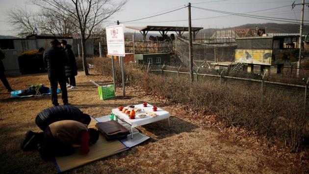 A North Korean refugee’s family bow during a memorial service for other North Korean family members, in front of a barbed wire fence near the demilitarized zone separating the two Koreas, in Paju, during Seolnal, the Lunar New Year’s day. (Kim Hong-Ji / REUTERS) A North Korean refugee’s family bow during a memorial service for other North Korean family members, in front of a barbed wire fence near the demilitarized zone separating the two Koreas, in Paju, during Seolnal, the Lunar New Year’s day. (Kim Hong-Ji / REUTERS)