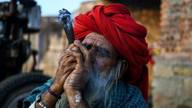 “Not long ago, village hierarchies in our communities were determined by the size of each family’s herd. Not anymore,” lamented the elder Raika, as he smoked a pipe and sipped his tea on the outskirts of Rani. “These days, just like old men, no one is really interested in them,” he added. (Chandan Khanna / AFP)