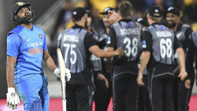 Rohit Sharma walks, out for 1, caught by New Zealand's Lockie Fergusson off the bowling of Tim Southee. (AP)