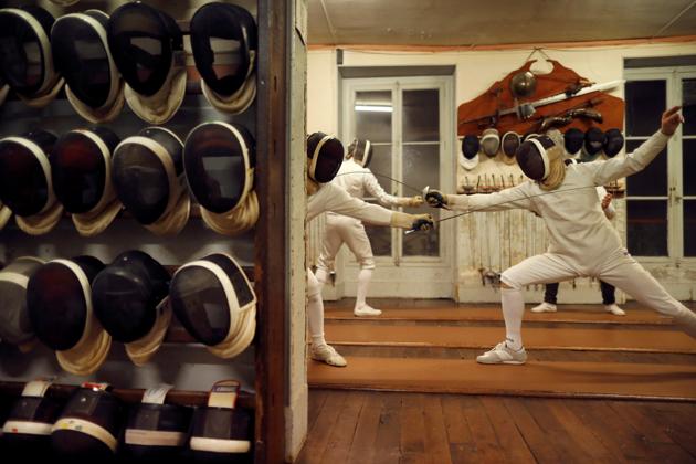 Members attend a training session at the Salle d’Armes Coudurier in central Paris, France. Things are still done the old fashioned way here, at the oldest fencing club in Paris, keeping the gentleman’s traditions of the sport alive. (Charles Platiau / REUTERS)