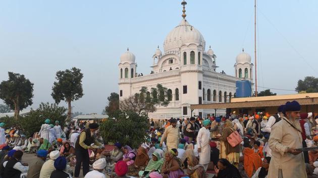 Pilgrims eat food in front of Kartarpur Gurdwara Sahib after a groundbreaking ceremony for the Kartarpur Corridor in Kartarpur, Pakistan, on November 28, 2018.(AFP)