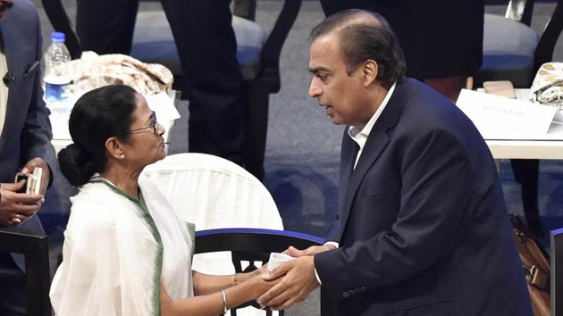West Bengal chief minister Mamata Banerjee shakes hand with Reliance Industries chairman Mukesh Ambani during 'Bengal Global Business Summit 2019', in Kolkata on February 7. (PTI Photo) West Bengal chief minister Mamata Banerjee shakes hand with Reliance Industries chairman Mukesh Ambani during 'Bengal Global Business Summit 2019', in Kolkata on February 7. (PTI Photo)