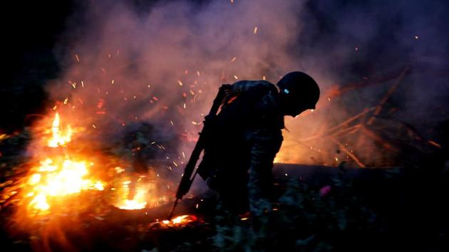 A soldier burns an illegal opium plantation. Arturo Garcia, a farmers rights activist in the state, said the government’s new ideas would only work if a really sustained and well-funded effort were made to offer residents a way out of the drug trade. “The state must throw all its weight into this region so that it begins to alleviate the conditions that have allowed violence,” he said. (Carlos Jasso / REUTERS)
