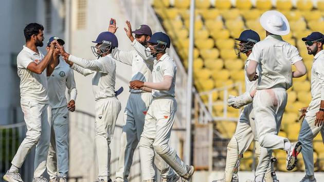 Vidarbha bowler Aditya Sarwate celebrates with teammates after dismissing Saurashtra batsman Cheteshwar Pujara.(PTI)
