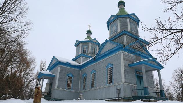 A guide waits for visitors outside the space museum located in Saint Paraskeva church in Pereyaslav-Khemlnytsky, a small town some 80 kilometers southeast of Kiev. Inside this traditional Orthodox church topped with a gold cross, instead of icons, visitors can see a lunar rover and the helmet of the first man in space Yuri Gagarin. (Aleksey Filippov / AFP) A guide waits for visitors outside the space museum located in Saint Paraskeva church in Pereyaslav-Khemlnytsky, a small town some 80 kilometers southeast of Kiev. Inside this traditional Orthodox church topped with a gold cross, instead of icons, visitors can see a lunar rover and the helmet of the first man in space Yuri Gagarin. (Aleksey Filippov / AFP)