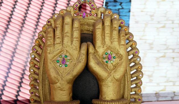 The urban legend is that after the 1975-77 Emergency, when former Prime Minister Indira Gandhi lost the election and the party symbol, the cow and calf, she chose one of the hands as her party symbol after hearing about the temple. (HT Photo) The urban legend is that after the 1975-77 Emergency, when former Prime Minister Indira Gandhi lost the election and the party symbol, the cow and calf, she chose one of the hands as her party symbol after hearing about the temple. (HT Photo)