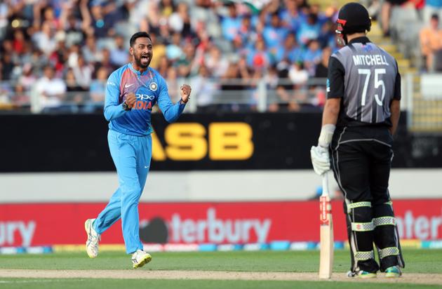 India's Krunal Pandya (L) celebrates the wicket of New Zealand's Daryl Mitchell (R) during the second Twenty20 international cricket match between New Zealand and India in Auckland. (AFP)