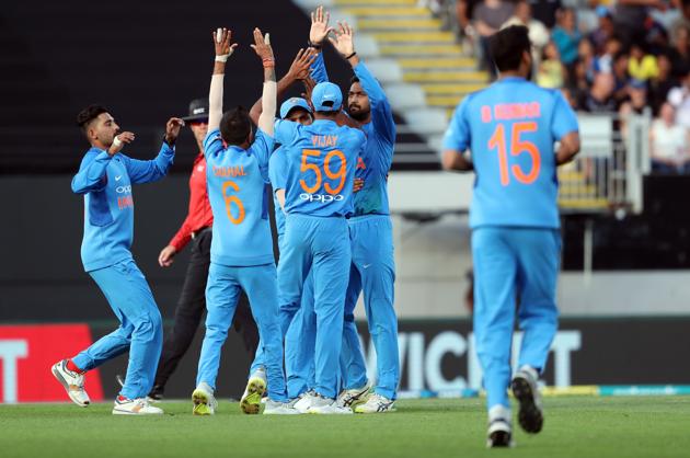 Indian players celebrate the wicket of New Zealand's Colin Munro during the second Twenty20 international cricket match between New Zealand and India in Auckland. (AFP)